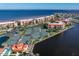 Aerial view showcasing the community with tennis courts, waterfront, and manicured grounds at 85 Vivante Blvd # 8542, Punta Gorda, FL 33950