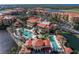 Expansive aerial view showcasing the community's pools, clubhouse, and lush landscaping at 85 Vivante Blvd # 8542, Punta Gorda, FL 33950