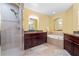 Bathroom with shower, bathtub, granite countertops, and updated vanity at 85 Vivante Blvd # 8542, Punta Gorda, FL 33950