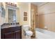 Bathroom with a tiled shower, bathtub, and a vanity with a dark wood cabinet at 85 Vivante Blvd # 8542, Punta Gorda, FL 33950