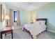 A cozy bedroom featuring carpet floors, a ceiling fan, and a picturesque outdoor view at 85 Vivante Blvd # 8542, Punta Gorda, FL 33950