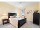Comfortable bedroom with neutral tones, a ceiling fan, and large windows with curtains at 85 Vivante Blvd # 8542, Punta Gorda, FL 33950