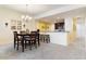 Cozy dining area featuring a chandelier and adjacent breakfast bar with seating at 85 Vivante Blvd # 8542, Punta Gorda, FL 33950