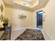 Well-lit elevator lobby area with tiled floors, a console table, and convenient access to the elevator at 85 Vivante Blvd # 8542, Punta Gorda, FL 33950