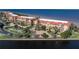 Multi-story condo building with red tile roofs, balconies, and lush landscaping, situated near waterfront at 85 Vivante Blvd # 8542, Punta Gorda, FL 33950