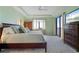 Bright main bedroom with a ceiling fan, carpet flooring and a sliding glass door to the patio at 85 Vivante Blvd # 8542, Punta Gorda, FL 33950