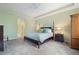 Bedroom with neutral walls, carpet flooring, ceiling fan, and furnishings at 85 Vivante Blvd # 8542, Punta Gorda, FL 33950