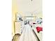 Bright and airy bedroom featuring two beds, wood flooring, and a stylish white dresser at 9400 Little Gasparilla Is # C2, Placida, FL 33946