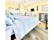 Bright and airy bedroom featuring two beds, wooden floors and decor throughout at 9400 Little Gasparilla Is # C2, Placida, FL 33946
