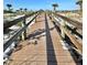 Scenic wooden boardwalk leading to the beach at 9400 Little Gasparilla Is # C2, Placida, FL 33946