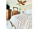 Inviting bedroom featuring a carved wood bed, a ceiling fan, and a dresser with a TV at 9400 Little Gasparilla Is # C2, Placida, FL 33946
