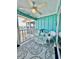 Outdoor seating area with wicker chairs, a glass table, and view to water at 9400 Little Gasparilla Is # C2, Placida, FL 33946