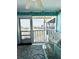 View from a screened porch features waterfront views, wicker chairs, and a glass table at 9400 Little Gasparilla Is # C2, Placida, FL 33946