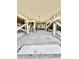 Open space under house with a raised platform, stairs, and structural support beams at 9400 Little Gasparilla Is # C2, Placida, FL 33946