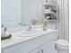 Bright bathroom with a modern vanity, white counter-top, and stylish decor enhancing a clean aesthetic at 9519 Turtle Grass Cir, Punta Gorda, FL 33950