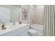 Well-lit bathroom features a shower-tub combination, white fixtures, and clean design for a functional space at 9519 Turtle Grass Cir, Punta Gorda, FL 33950