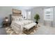 Cozy bedroom with neutral tones, a patterned rug, and two windows for natural light at 9519 Turtle Grass Cir, Punta Gorda, FL 33950