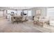 Open-concept living space with a dining area and modern furnishings at 9519 Turtle Grass Cir, Punta Gorda, FL 33950