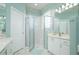Modern bathroom featuring glass shower, neutral finishes, and white cabinets, offering a clean aesthetic at 10488 Princess Ct, Punta Gorda, FL 33955