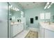 Bright bathroom with dual vanities, a spacious shower, and elegant finishes at 10488 Princess Ct, Punta Gorda, FL 33955