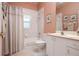 Well-maintained bathroom with a shower-tub combo, single sink vanity, and classic tile finishes at 10488 Princess Ct, Punta Gorda, FL 33955