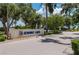 Seminole Lakes community signage is complemented by manicured landscaping and palm trees at 10488 Princess Ct, Punta Gorda, FL 33955