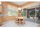 Bright dining area with tile flooring and a view to the backyard at 10488 Princess Ct, Punta Gorda, FL 33955