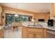 Bright kitchen and dining area with granite counters and neutral cabinets, great for Gathering meals and entertaining at 10488 Princess Ct, Punta Gorda, FL 33955