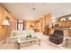 Comfortable living room with plush seating and open layout to the kitchen, perfect for relaxation at 10488 Princess Ct, Punta Gorda, FL 33955
