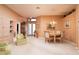 Spacious formal living room with elegant chandelier and views of the front entryway at 10488 Princess Ct, Punta Gorda, FL 33955