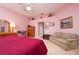 Large bedroom boasts ample natural light, a ceiling fan, and warm, inviting decor at 10488 Princess Ct, Punta Gorda, FL 33955
