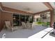 The home's spacious, screened-in patio has a ceiling fan and outdoor dining furniture set at 10488 Princess Ct, Punta Gorda, FL 33955