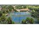 Aerial view of well-maintained tennis courts, providing a recreational amenity for residents at 10488 Princess Ct, Punta Gorda, FL 33955