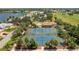 Scenic aerial shot of tennis courts nestled within a lush community, offering a resort-style living experience at 10488 Princess Ct, Punta Gorda, FL 33955