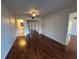 Spacious bedroom with dark wood floors and a ceiling fan at 1051 Forrest Nelson Blvd # M 103, Port Charlotte, FL 33952