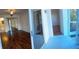 Bedroom featuring dark wood floors and access to screened porch at 1051 Forrest Nelson Blvd # M 103, Port Charlotte, FL 33952