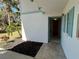 Condo entrance offers tiled floors and painted trim around the door and windows at 1051 Forrest Nelson Blvd # M 103, Port Charlotte, FL 33952