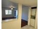 Bright kitchen with tiled floors has an adjoining dining area, laundry closet and overlooks the living room at 1051 Forrest Nelson Blvd # M 103, Port Charlotte, FL 33952