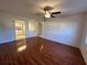 Comfortable living room with laminate floors and an open view into the kitchen and entry hall at 1051 Forrest Nelson Blvd # M 103, Port Charlotte, FL 33952
