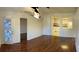 Bright living room with neutral walls and dark floors leads to the kitchen at 1051 Forrest Nelson Blvd # M 103, Port Charlotte, FL 33952