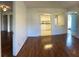 Bright and open living room featuring dark wood floors and view into the kitchen at 1051 Forrest Nelson Blvd # M 103, Port Charlotte, FL 33952