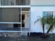 Screened-in patio with view of small palm tree at 1051 Forrest Nelson Blvd # M 103, Port Charlotte, FL 33952