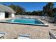 Enjoy relaxing by the crystal clear community pool surrounded by lush landscaping and comfortable lounge chairs at 1051 Forrest Nelson Blvd # M 103, Port Charlotte, FL 33952