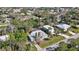 Aerial view of home, lush surroundings, and neighborhood at 1052 Archer St, Port Charlotte, FL 33952