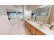 Bathroom features a double sink vanity, a large tub, and tiled floors at 1055 & 1075 Yorkshire St St, Port Charlotte, FL 33952