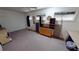 Unfurnished bedroom with windows, ceiling fan, and a dresser with carpet flooring at 1055 & 1075 Yorkshire St St, Port Charlotte, FL 33952