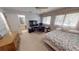 Light-filled bedroom complete with a desk, TV, dresser, and private full bathroom at 1055 & 1075 Yorkshire St St, Port Charlotte, FL 33952