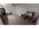Unfurnished room with a ceiling fan and carpet flooring, perfect for a home office at 1055 & 1075 Yorkshire St St, Port Charlotte, FL 33952