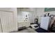 Garage interior with utility sink, water heater and additional storage options, but unorganized at 1055 & 1075 Yorkshire St St, Port Charlotte, FL 33952