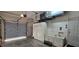 Garage with sink, storage cabinets, and functional space, including garage door at 1055 & 1075 Yorkshire St St, Port Charlotte, FL 33952